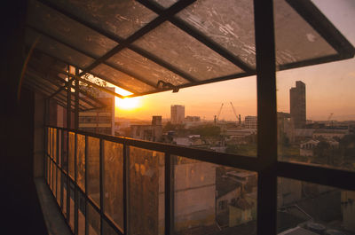 Cityscape against sky during sunset