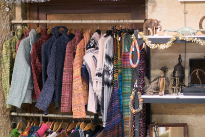 Clothes hanging in store for sale