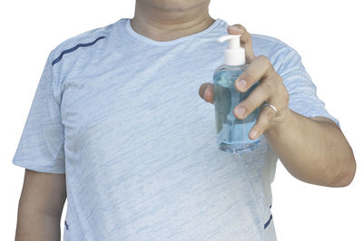 Midsection of man standing against white background