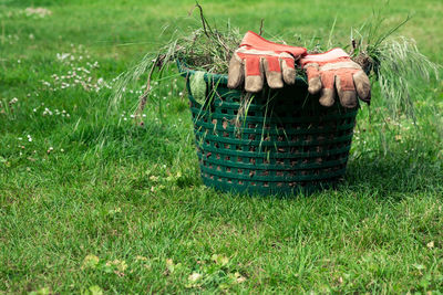 View of wicker basket on grassy field