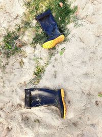 High angle view of shoes on field