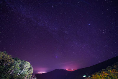 Low angle view of stars against sky at night