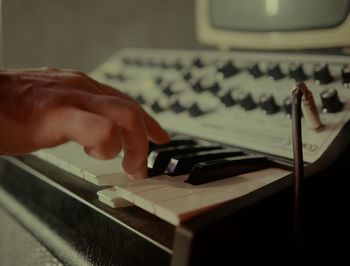 Cropped hands of person using sound mixer