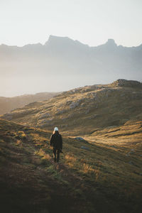 Rear view of man on mountain road