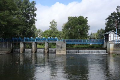 Bridge over river against sky