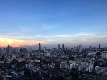 Cityscape against sky during sunset