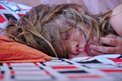 Close-up of girl sleeping on bed