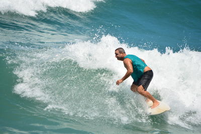 Full length of man surfing in sea