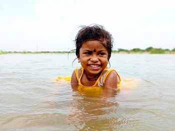 Portrait of smiling woman in water