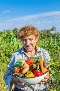 Portrait of woman holding salad