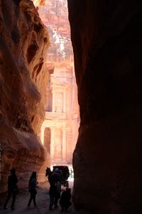 People walking in front of historical building