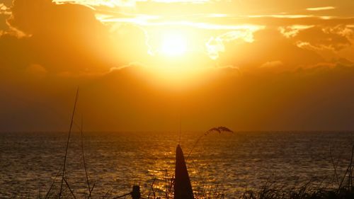 Scenic view of sea at sunset