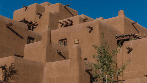 Low angle exterior view of adobe-style western building