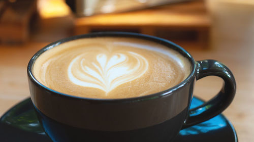 Close-up of cappuccino on table