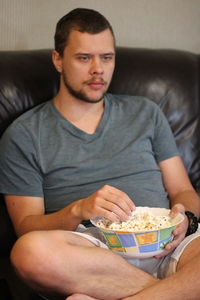 Young man eating food