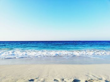 Scenic view of beach against clear sky