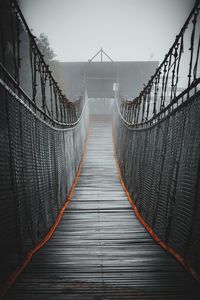 View of footbridge against sky