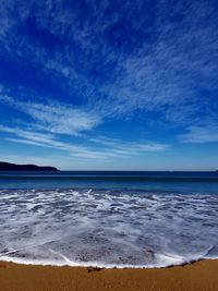 Scenic view of sea against blue sky