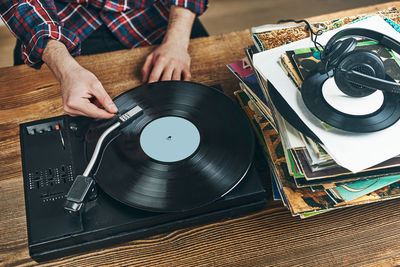 Listening to music from vinyl record. playing music from analog. retro music party. vintage style