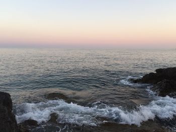 Scenic view of sea against clear sky during sunset