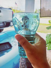 Close-up of hand holding glass