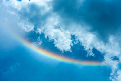 Low angle view of rainbow in sky