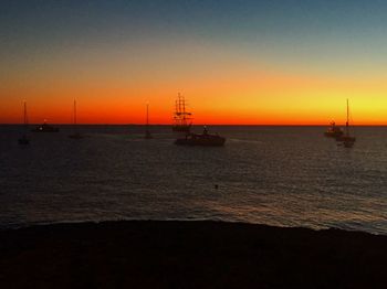 Silhouette of boat at sunset