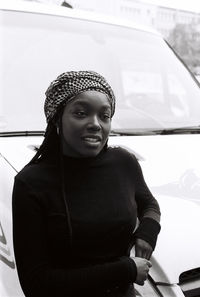 Portrait of smiling young woman in car