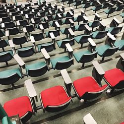 High angle view of empty chairs arranged in auditorium