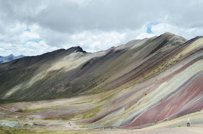 Scenic view of mountain against cloudy sky