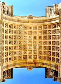 Low angle view of building against blue sky