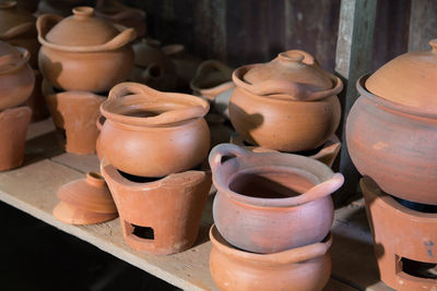 Various clay containers for sale at market stall