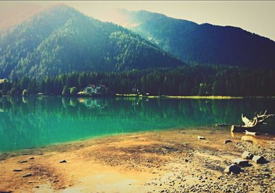 Scenic view of lake with mountains in background