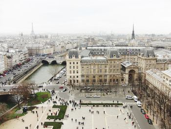 High angle view of people by seine river in city