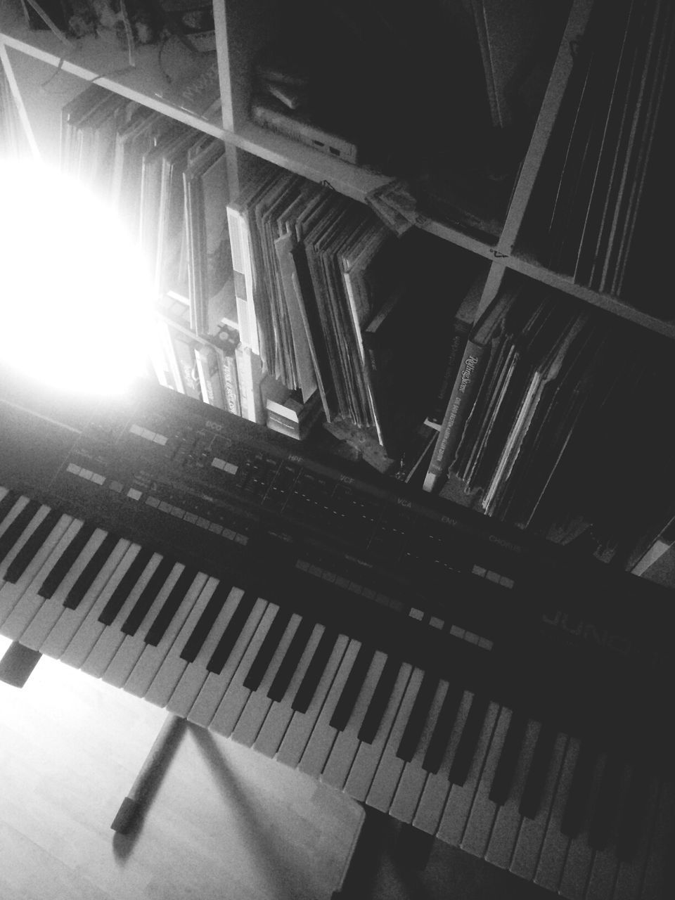 CLOSE-UP OF PIANO KEYS IN ROOM