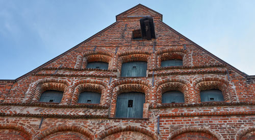 Low angle view of old building against sky