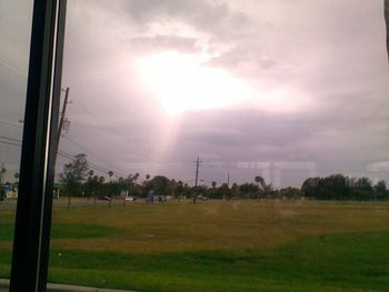 Scenic view of landscape against cloudy sky