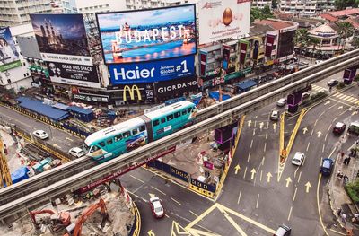 High angle view of monorail above street in city