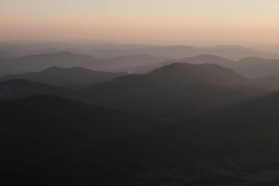 Scenic view of mountains against sky during sunset