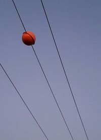 Low angle view of basketball hoop against clear sky