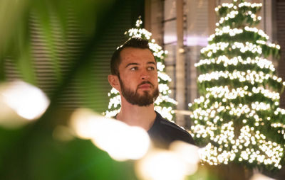 Portrait of young man looking away