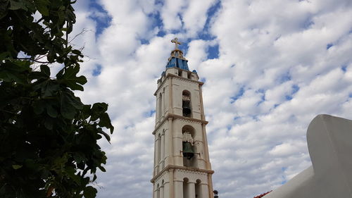 Low angle view of church and building against sky