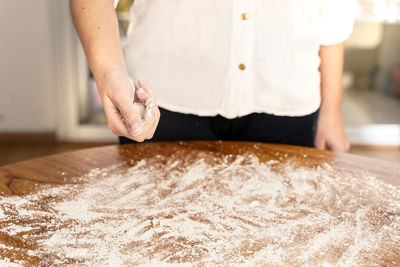 Midsection of woman preparing food