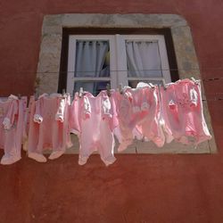 Clothes in front of built structure