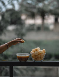 Close-up of hand holding drink