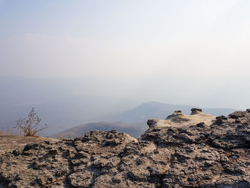 Rock formations on landscape against sky