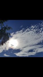 Low angle view of silhouette moon against blue sky