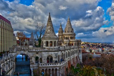 Fishermans bastion view of historic building against cloudy sky