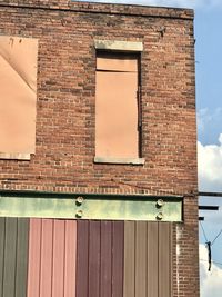 Low angle view of window on wall of building