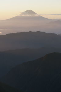 Scenic view of mountains against sky during sunset